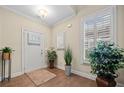 Inviting foyer with hardwood floors, plantation shutters, and decorative plants at , Acworth, GA 30101