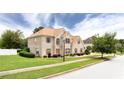 Attractive brick home with well-maintained lawn and mature trees in a neighborhood at 1236 Saxony Se Dr, Conyers, GA 30013