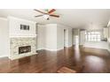 Spacious living room featuring a fireplace, hardwood floors, and an open floor plan at 3032 Hartford Mill Pl, Duluth, GA 30097