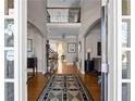 Grand foyer with hardwood floors, arched entryways, and a view of the upper-level balcony at 1615 Chattahoochee Run, Suwanee, GA 30024