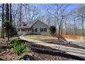 Lovely home showcasing a winding sidewalk, wood fence, and well-manicured landscaping at 241 Lancaster Cir, Marietta, GA 30066