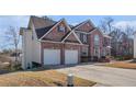 Well-maintained brick home with a two-car garage and a large driveway at 4230 Spur Look Xing, Douglasville, GA 30135