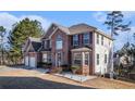 Beautifully landscaped brick home featuring an attached two car garage and private lot at 4230 Spur Look Xing, Douglasville, GA 30135