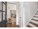 Bright foyer with hardwood floors, stairs, and an open view to the living spaces at 1514 Gilstrap Nw Ln, Atlanta, GA 30318
