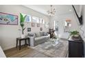 Bright living room with contemporary decor, large windows, and hardwood flooring at 203 Color Cir, Atlanta, GA 30317