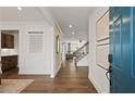 Inviting entryway with hardwood floors flows into the open floor plan and staircase with natural light at 5310 Julep Ct, Cumming, GA 30028