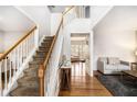 Inviting entryway with hardwood floors, staircase and modern design details at 3550 Myrtlewood Chase Nw, Kennesaw, GA 30144
