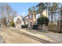 Charming home with a manicured lawn, brick accents, and a spacious two-car garage at 3550 Myrtlewood Chase Nw, Kennesaw, GA 30144