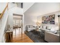 Bright living room featuring hardwood floors, modern decor, and a textured accent wall at 3550 Myrtlewood Chase Nw, Kennesaw, GA 30144