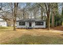 Well-maintained home with a tidy front yard and mature trees at 1210 Beech St, Marietta, GA 30062