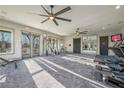 Onsite gym features modern fitness equipment, mirrored walls, and ceiling fans for comfortable workouts at 61 Okeechobee Way, Braselton, GA 30548
