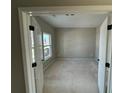 A bright office space with a large window and double doors for added privacy at 61 Okeechobee Way, Braselton, GA 30548