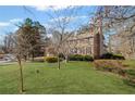 A well-maintained lawn frames this two-story home, complemented by mature trees at 4481 Windsor Oaks Dr, Marietta, GA 30066