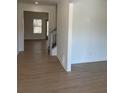 Bright hallway boasts wood-look floors leading into the home's interior at 1335 Tumblerock Way, Loganville, GA 30052