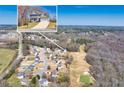 This is an aerial view of the home with a large yard and surrounding neighborhood at 49 Inverness Ct, Hiram, GA 30141