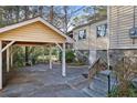 Covered carport with space for parking and access to the home's backyard and lower level entrance at 1258 Merry Ne Ln, Atlanta, GA 30329