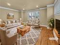 Bright living room featuring hardwood floors, neutral paint, and a large window at 3628 Princeton Ave, Atlanta, GA 30337