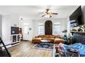 Inviting living space featuring hardwood floors, a fireplace, and an abundance of natural light at 1888 Mallard Nw St, Atlanta, GA 30318