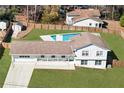 Aerial view of the home showcasing its large backyard, in-ground swimming pool, and privacy fence at 4554 Mountain Creek Ne Dr, Roswell, GA 30075