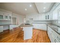 Spacious kitchen with granite countertops, a breakfast bar, and ample cabinet space at 3968 Belle Glade Ct, Snellville, GA 30039
