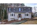 Charming two-story home featuring a gray top, white brick bottom and a landscaped front yard at 2748 Saddle Ridge Lake Dr, Marietta, GA 30062