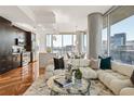 Open-concept living space with gourmet kitchen, plush seating, and natural light at 1080 Peachtree Ne St # 2011, Atlanta, GA 30309