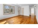 Beautiful living room with hardwood floors, large windows, and neutral paint at 1179 Aleamo Dr, Marietta, GA 30062