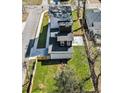 An aerial view displays a modern home featuring a fenced backyard and proximity to neighboring houses at 662 S Grand Nw Ave, Atlanta, GA 30318