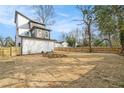 Expansive backyard showcasing a newly seeded lawn ready for outdoor activities at 662 S Grand Nw Ave, Atlanta, GA 30318