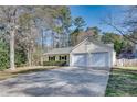 Lovely single-story home featuring a two-car garage, neutral siding, and a spacious driveway at , Kennesaw, GA 30152