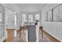 Inviting home office with natural light, hardwood floors, and refined decor for a serene workspace at 1654 Summersweet Ln, Dacula, GA 30019