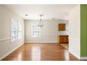 Charming dining area with hardwood floors and bright windows, offering ample space for Gathering gatherings at 3480 Beech Dr, Decatur, GA 30032