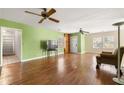 Bright living room featuring gleaming hardwood floors, natural light, and ceiling fans for added comfort at 3480 Beech Dr, Decatur, GA 30032