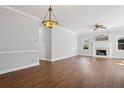 Living room with a fireplace, hardwood floors and a chandelier at 4010 Arborwood Ln, Tucker, GA 30084