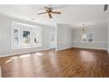 Open-concept living room with lots of natural light and hardwood-style flooring at 4010 Arborwood Ln, Tucker, GA 30084