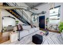 Inviting living room with a unique rug, comfortable seating, and industrial-style design at 400 Village Ne Pkwy # 114, Atlanta, GA 30306