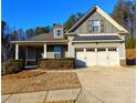 Charming exterior view showcasing the home's architectural details and well-maintained landscaping at 42 Champions Crossing, Villa Rica, GA 30180