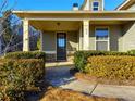 Inviting front entrance with charming stone accents and well-maintained landscaping at 42 Champions Crossing, Villa Rica, GA 30180