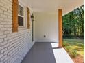 A close view of the covered front porch, painted in neutral colors at 1875 Creekside Ct, Decatur, GA 30032