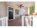 Inviting front porch featuring a ceiling fan, seating, and a stylish black front door at 2541 Kickerillo Se Way, Atlanta, GA 30316