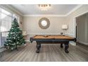 Cozy game room featuring a pool table, decorative mirror, and cheerful holiday decor at 113 Glenmore Ln, Mcdonough, GA 30253