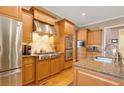 Modern kitchen featuring stainless steel appliances, granite countertops, and custom wood cabinetry at 1835 Leighton Ne Ln, Marietta, GA 30062