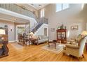 Bright, high-ceilinged living room with hardwood floors, elegant staircase, and neutral-toned decor at 1835 Leighton Ne Ln, Marietta, GA 30062
