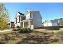 Attractive two-story home featuring brick and siding, a two-car garage, and a well-kept lawn at 2453 Osceola Rd, Lithonia, GA 30058