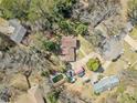 A top-down aerial shot highlights the property layout, swimming pool, and surrounding neighborhood at 4648 Danna Dr, Austell, GA 30106