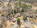 An aerial view of the property featuring a swimming pool, spacious yard, and a peaceful residential neighborhood at 4648 Danna Dr, Austell, GA 30106