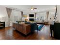 Bright living room with hardwood floors, fireplace, and large windows with blinds at 1818 Cromwell Walk, Dunwoody, GA 30338