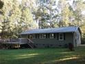 Backyard view featuring a wooden deck and ample space for outdoor activities at 23 Holub Path, Dallas, GA 30157