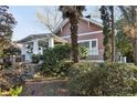 Inviting craftsman-style home with covered porch, stone accents and mature landscaping at 313 5Th Ne St, Atlanta, GA 30308