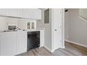 Kitchen with stainless steel sink, appliances, and black dishwasher at 5940 Hampton Ct, Atlanta, GA 30349